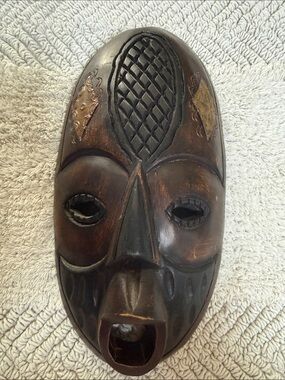 Carved Wooden Tribal Mask in Dark Brown